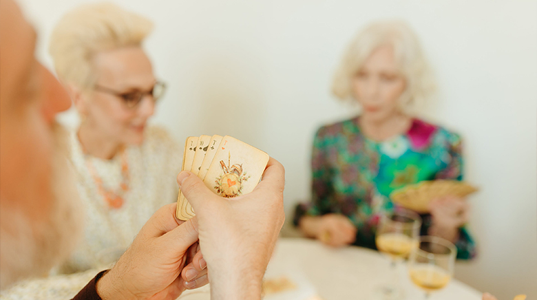 residents playing cards together