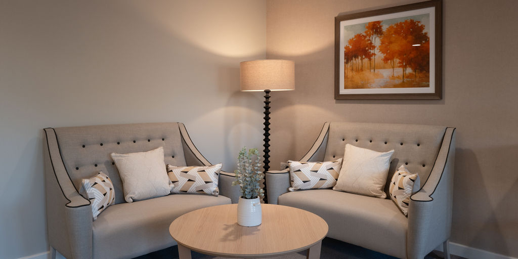 two comfortable sofas and a round table