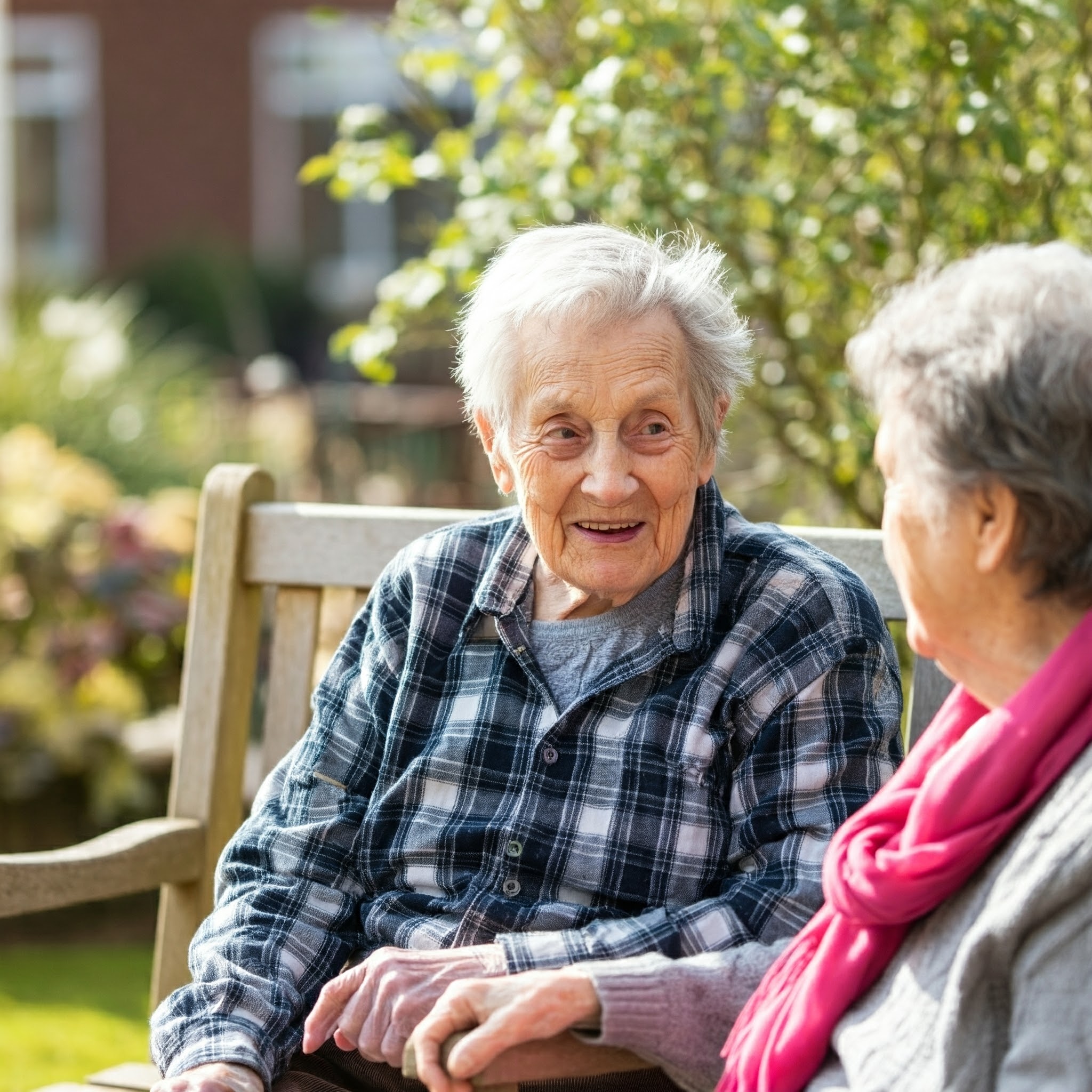 Residents chatting in a sunny garden