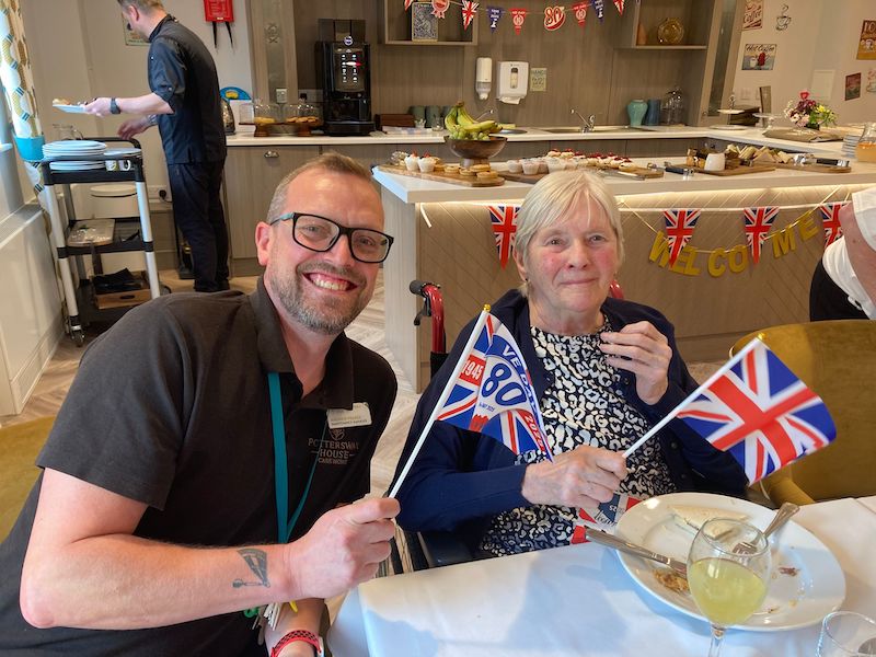 one of our team sat with a resident during VE day celebrations