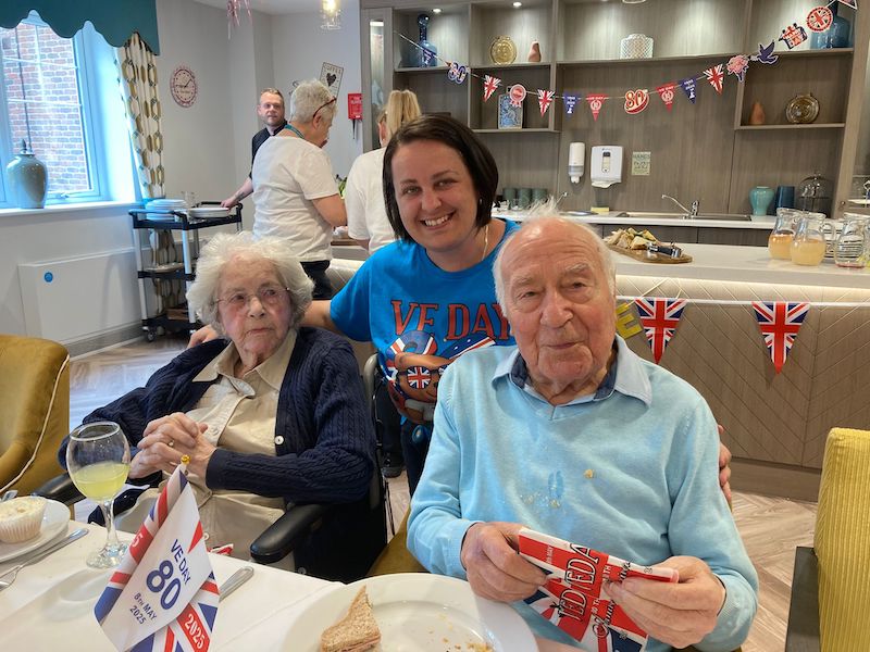 two of our residents sat with a loved one on VE day