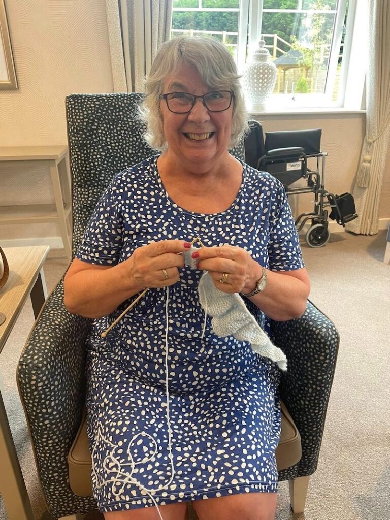 one of our residents knitting
