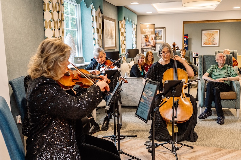 band playing cellos