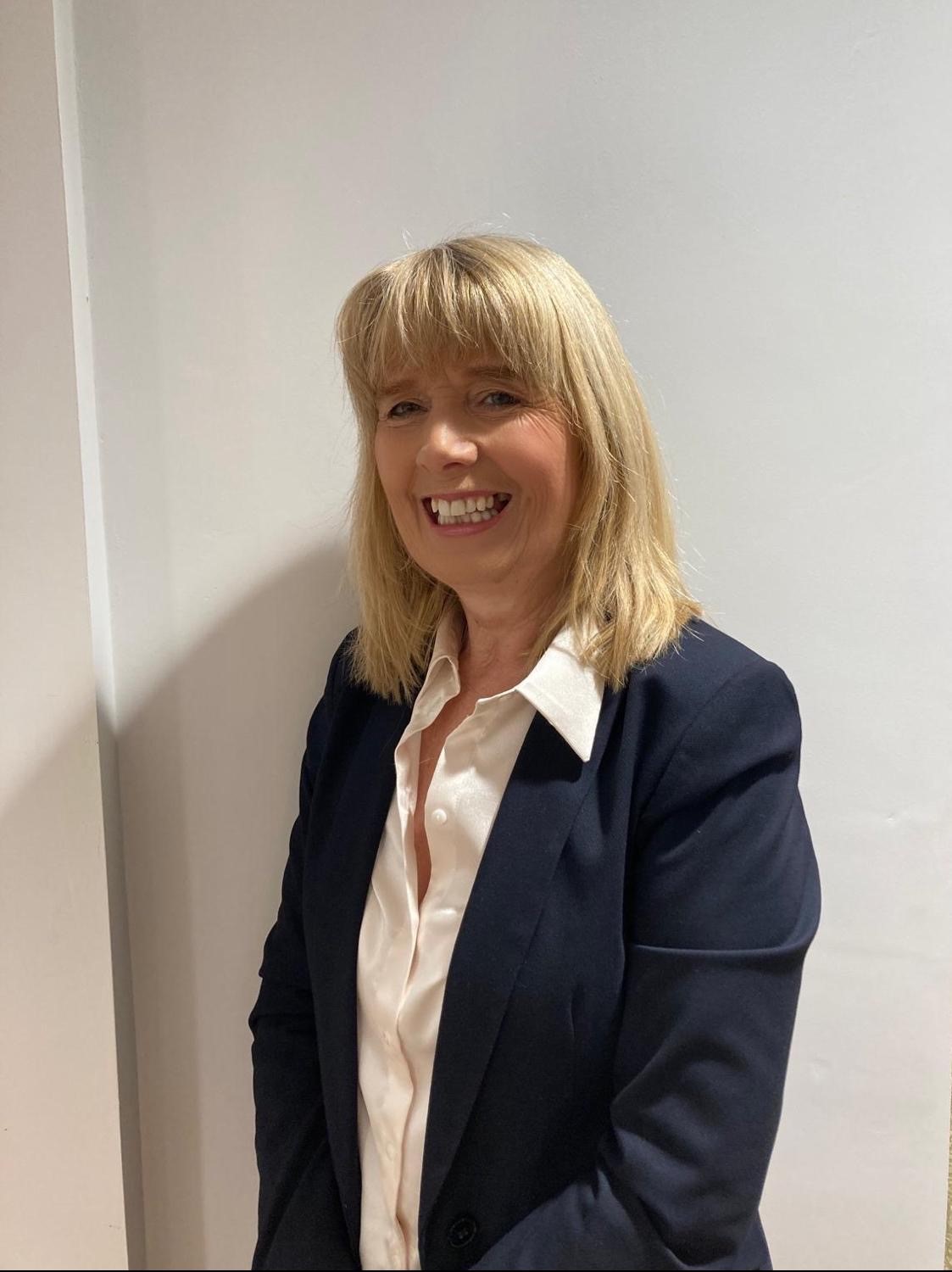 lady smiling at camera for staff photo