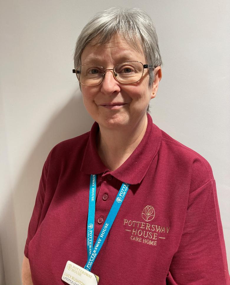 lady smiling at camera for staff photo