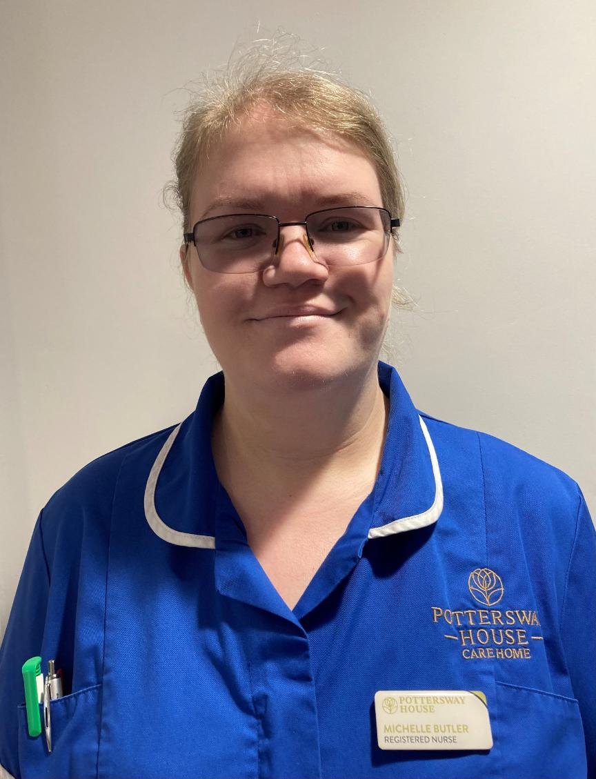 lady smiling at camera for staff photo