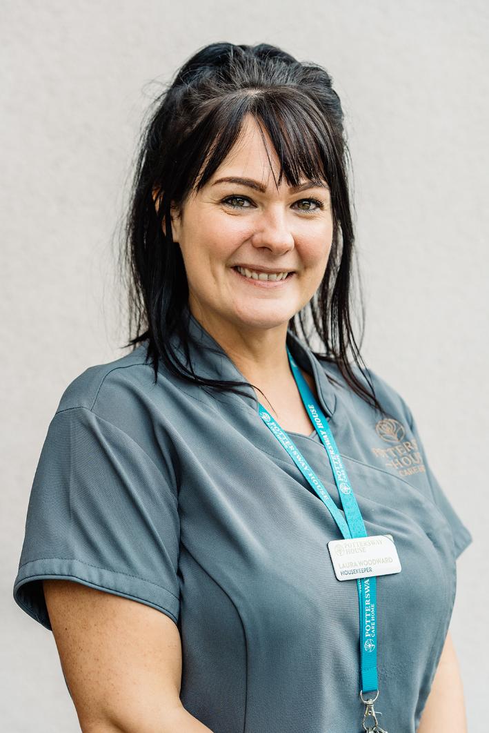 lady with black hair posing for staff photo
