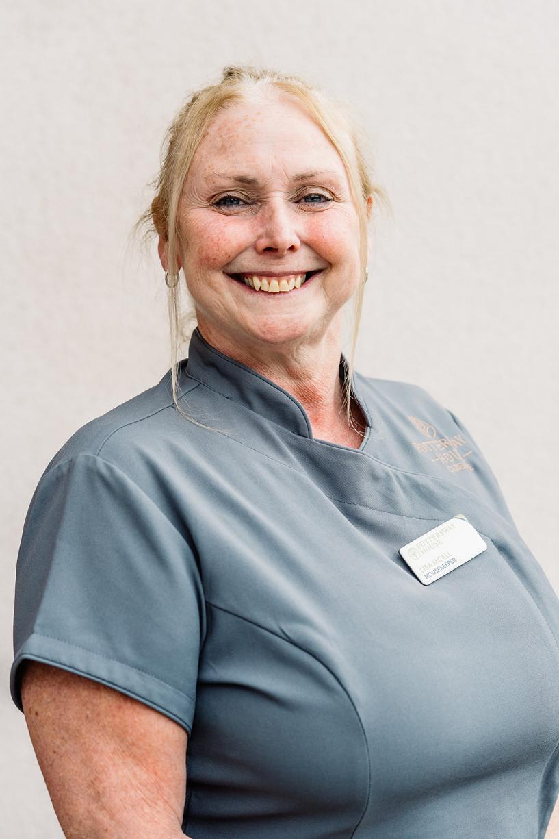 lady with blonde hair posing for staff photo