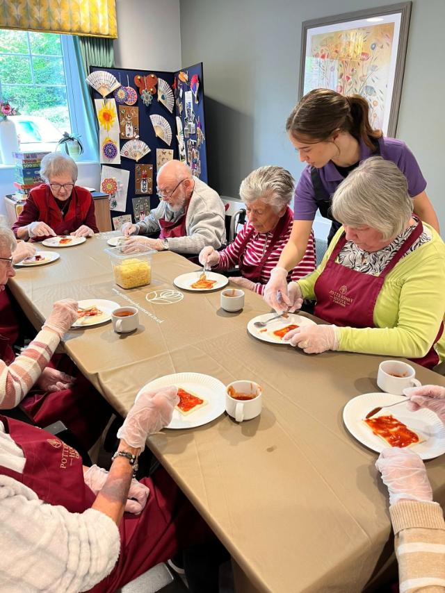 older adults sat at a table
