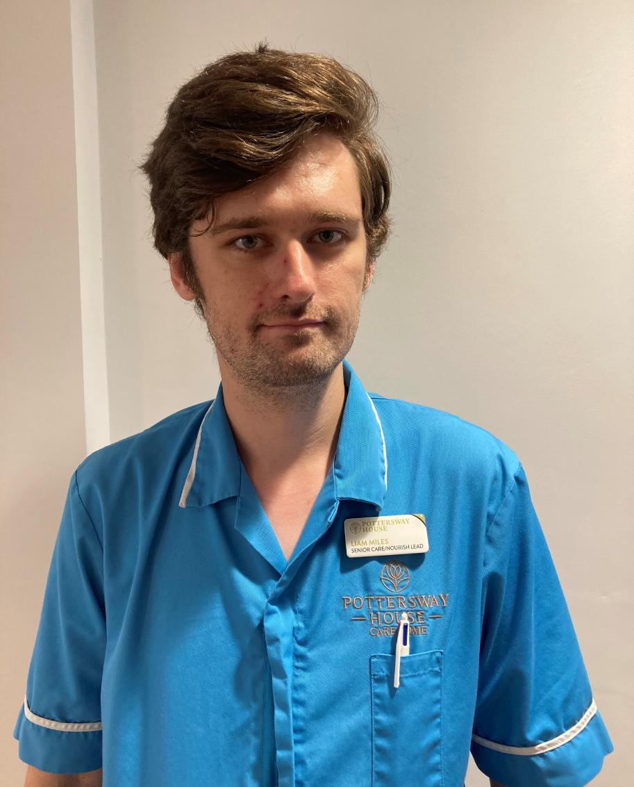 man smiling at camera for staff photo