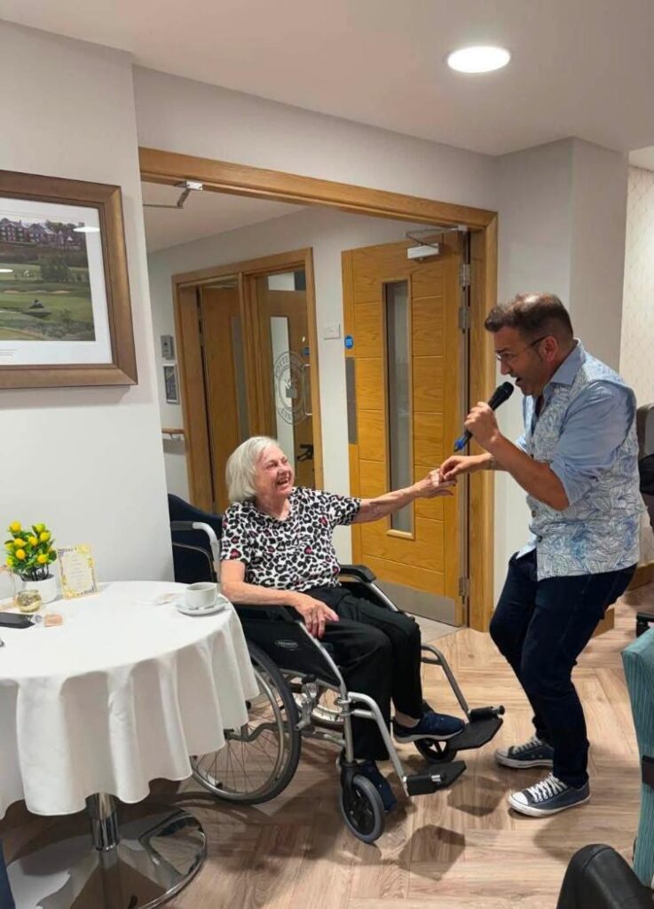 a man singing to an older lady