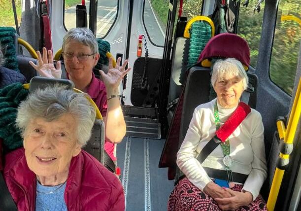 older ladies sat on a minibus